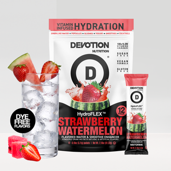 Devotion Nutrition HydroFLEX Strawberry Watermelon flavored powder drink mix shown with a large bag a single stick pack and a glass of water with strawberries and watermelon slices on a light gray background.