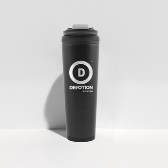 Black tumbler with 'Devotion Nutrition' logo on a light gray background