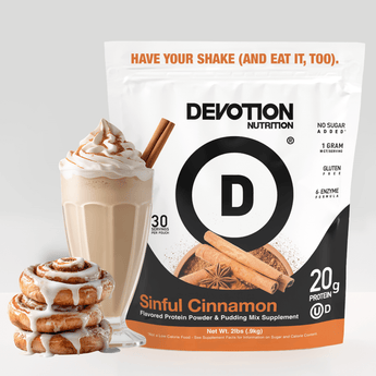 Devotion Nutrition Sinful Cinnamon protein powder package with a milkshake and cinnamon rolls on a light gray background