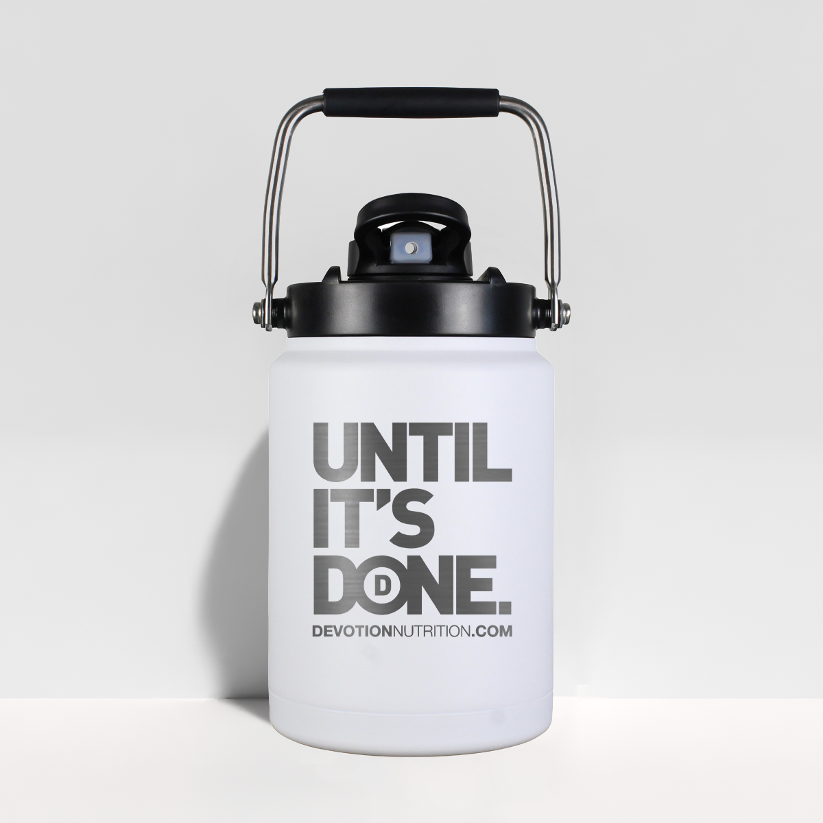 White half gallon water jug with black lid and 'UNTIL IT'S DONE' text on a light gray background