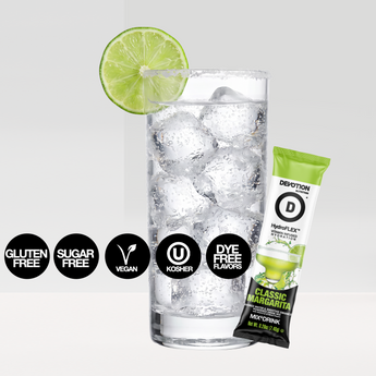 Devotion Nutrition HydroFlex Classic Margarita flavored drink mix packaging shown with a glass of iced water garnished with lime slices and a small packet  on a light gray background.
