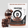 Devotion Nutrition Brownie Batter protein powder package with a milkshake and brownies on a light gray background