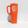 Orange mug with 'Devotion Nutrition' logo on a light gray background