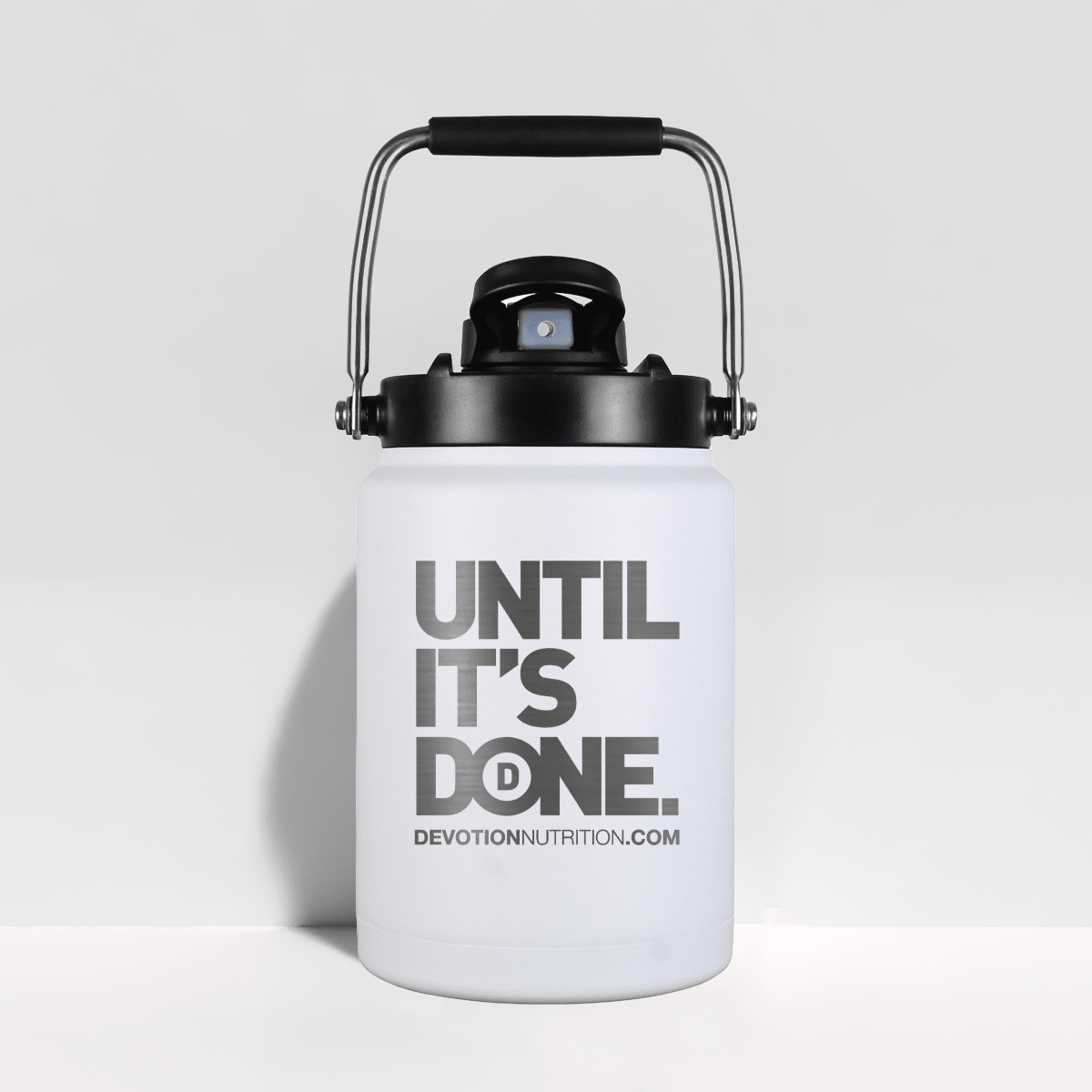 White half gallon water jug with black lid and 'UNTIL IT'S DONE' text on a light gray background