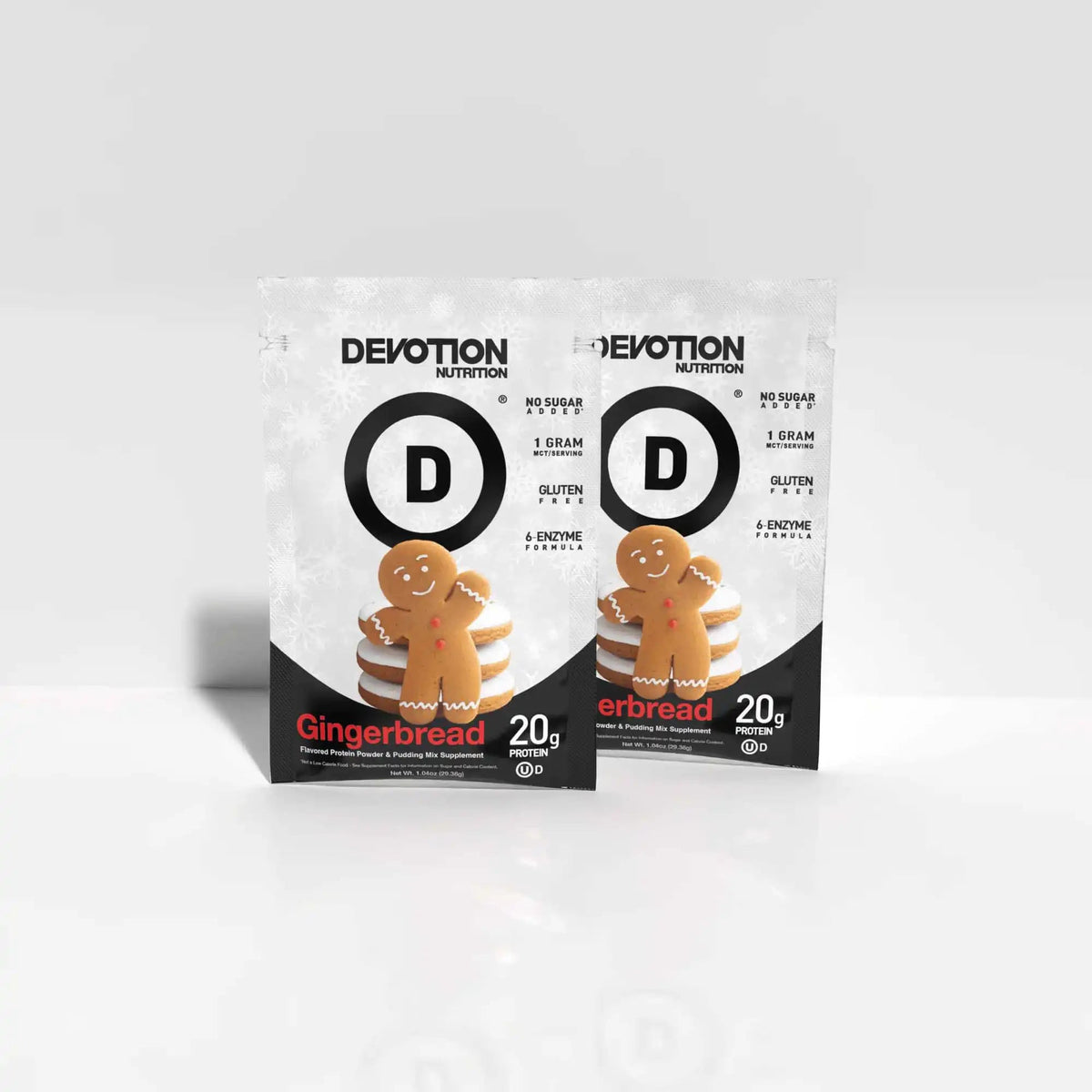 Two packages of Devotion Nutrition Gingerbread flavored erbread on a white background