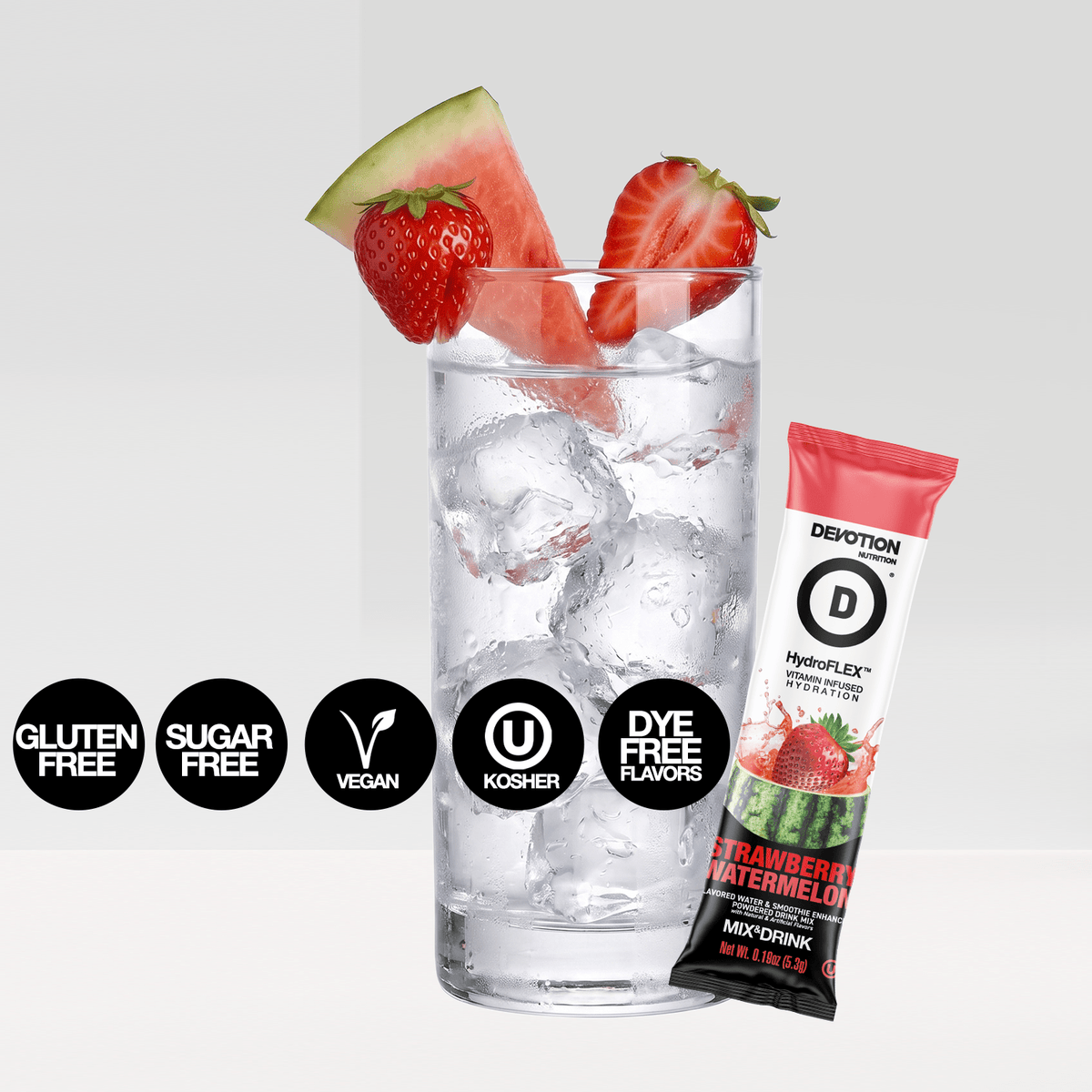 A Devotioib Strawberry Watermelon mixed drink stick pack shown next to a glass of clear iced water with watermelon and strawberry garnishes, on a light gray background with certification badges.