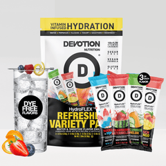 Devotion Nutrition HydroFlex Refreshing Variety Pack drink mix shown with a large black-and-yellow bag and four single-serve packets in blue, red, green, and orange flavors, alongside a glass of iced water with fruit garnish on a light gray background.