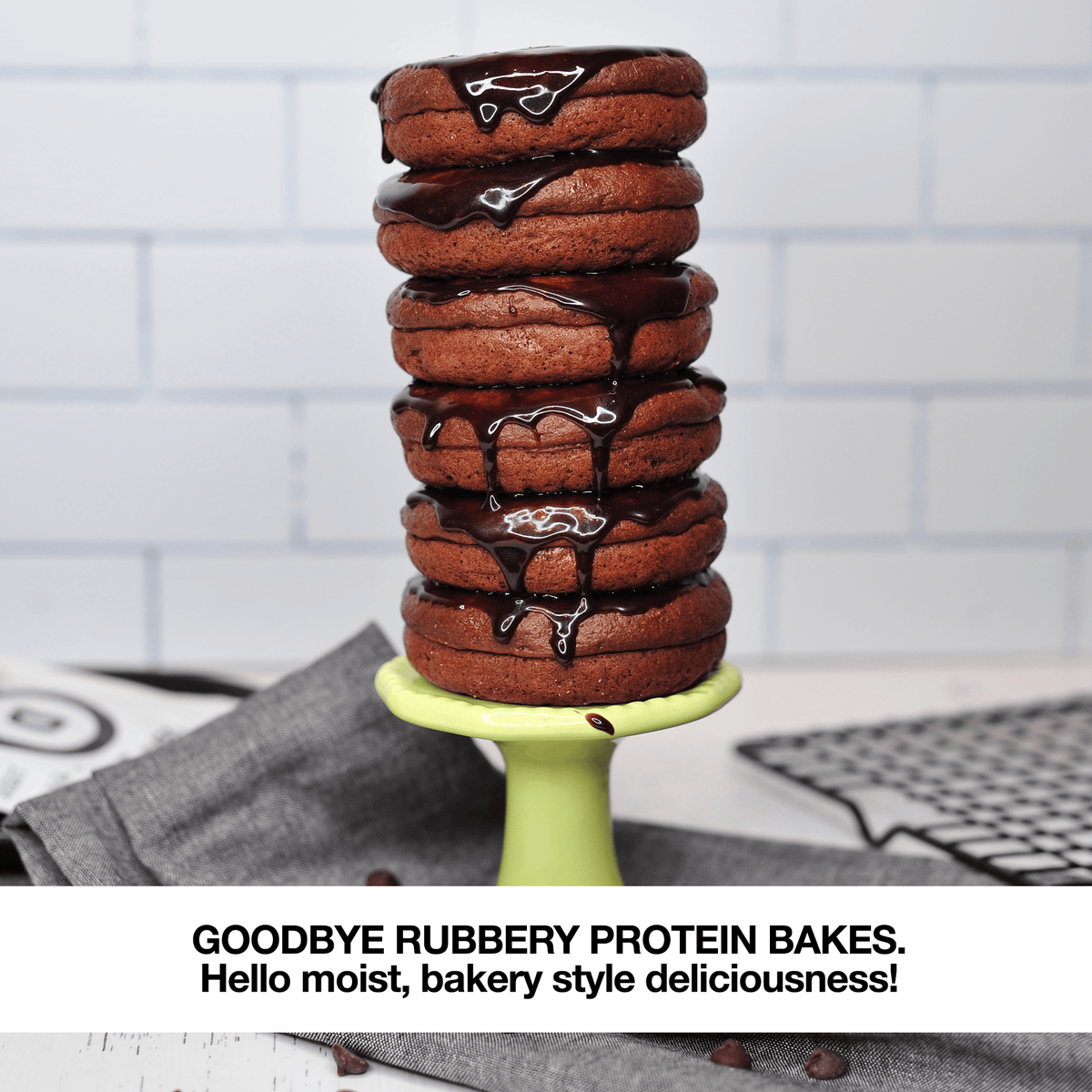 A stack of delicious Devotion protein donuts with chocolate drizzle and text that states Goodbye rubbery protein bakes.. hello moist bakery style goodness!