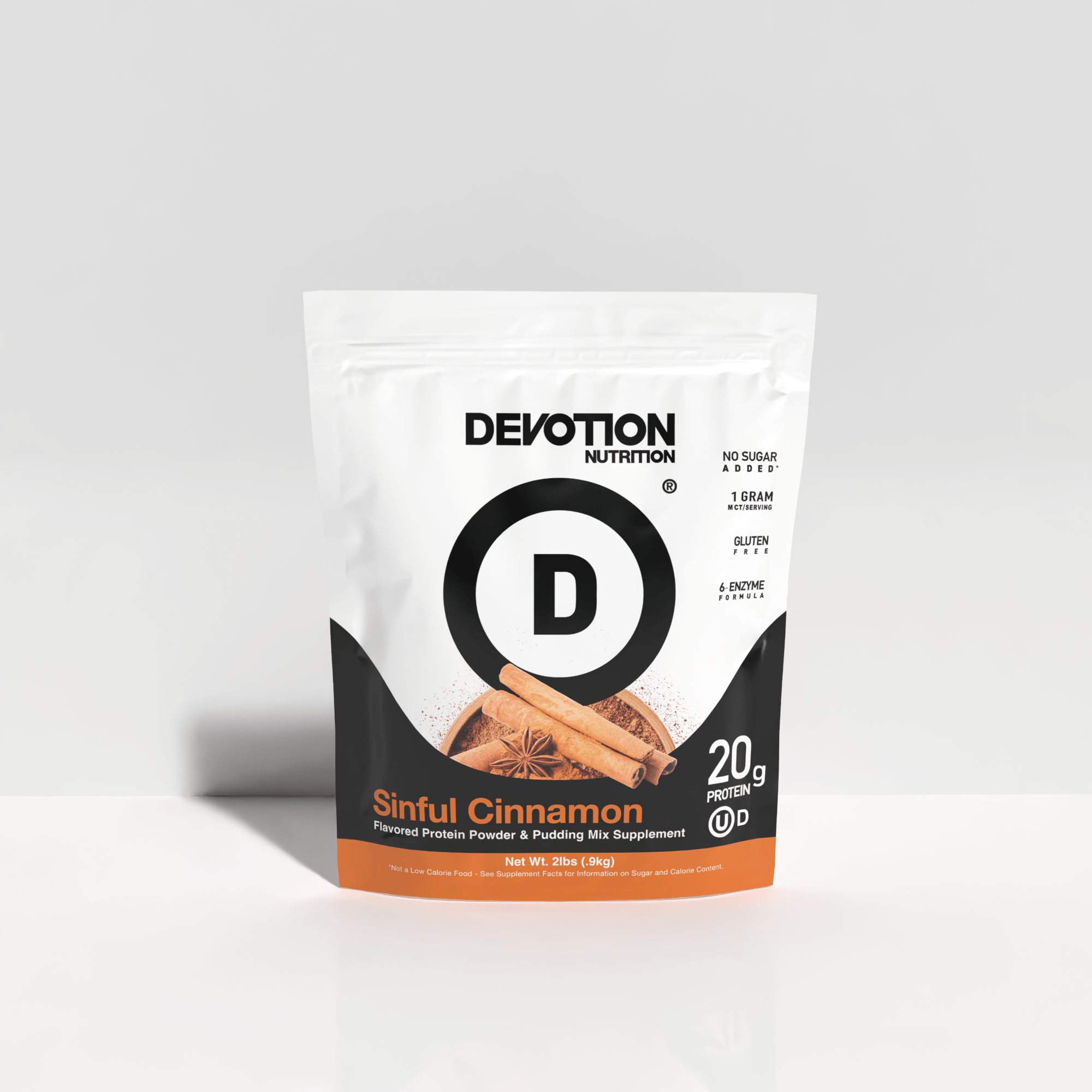 Devotion Nutrition Sinful Cinnamon protein powder package on a light gray background