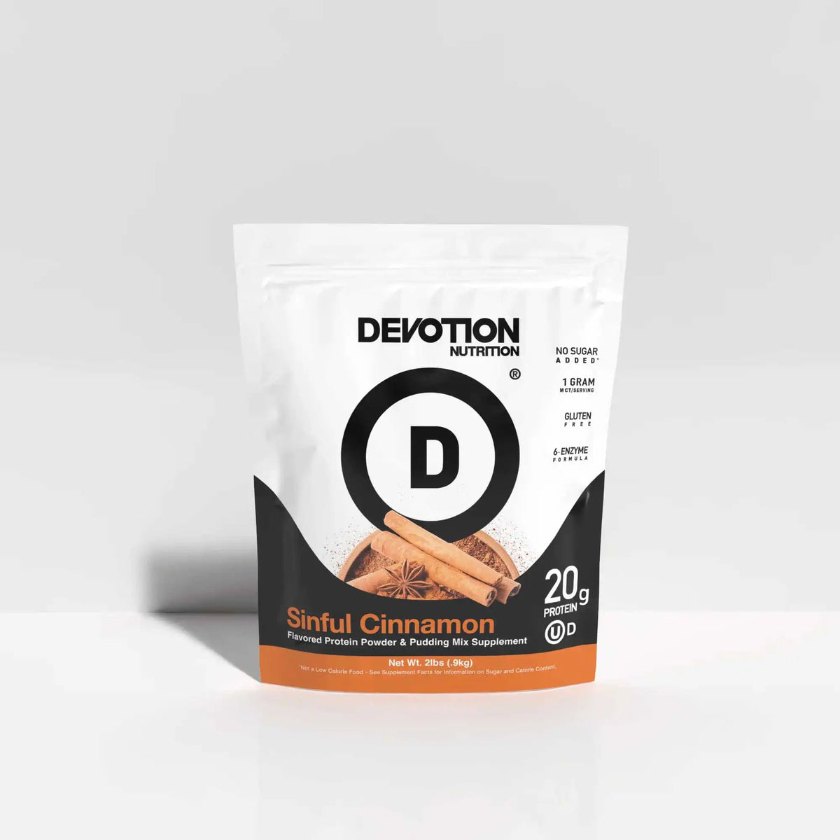 Devotion Nutrition Sinful Cinnamon protein powder package on a light gray background