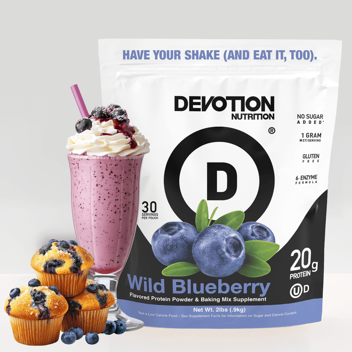 Devotion Nutrition Wild Blueberry protein powder package with a shake and muffins on a light gray background
